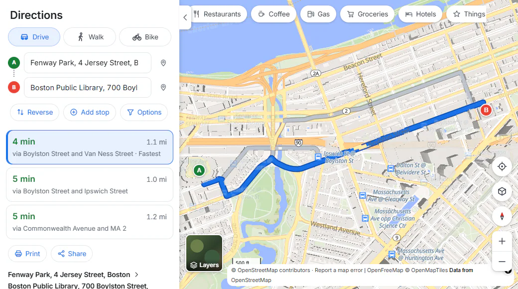 Directions from Fenway Park to the Boston Public Library: Drive, Walk and Bike buttons, boxes for the start and the destination, Reverse, Add stop and Options, three route choices with times and distances, and the chosen route drawn in blue on the map